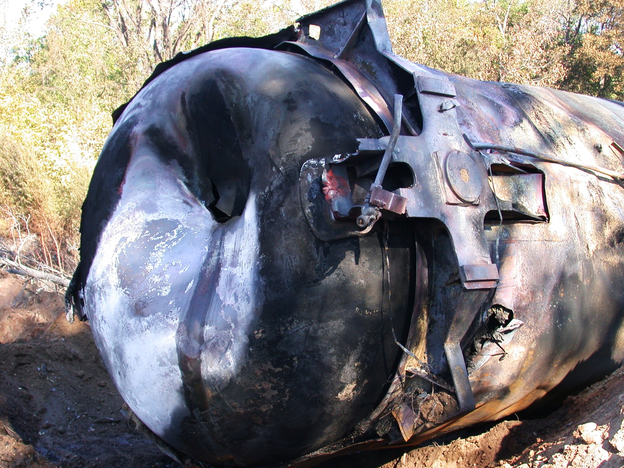 Burned remains of a rail car tanker.